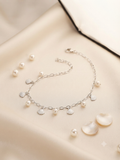Pearl and seashell charm bracelet